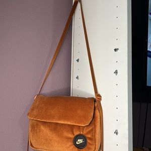 • NIKE Crossbody